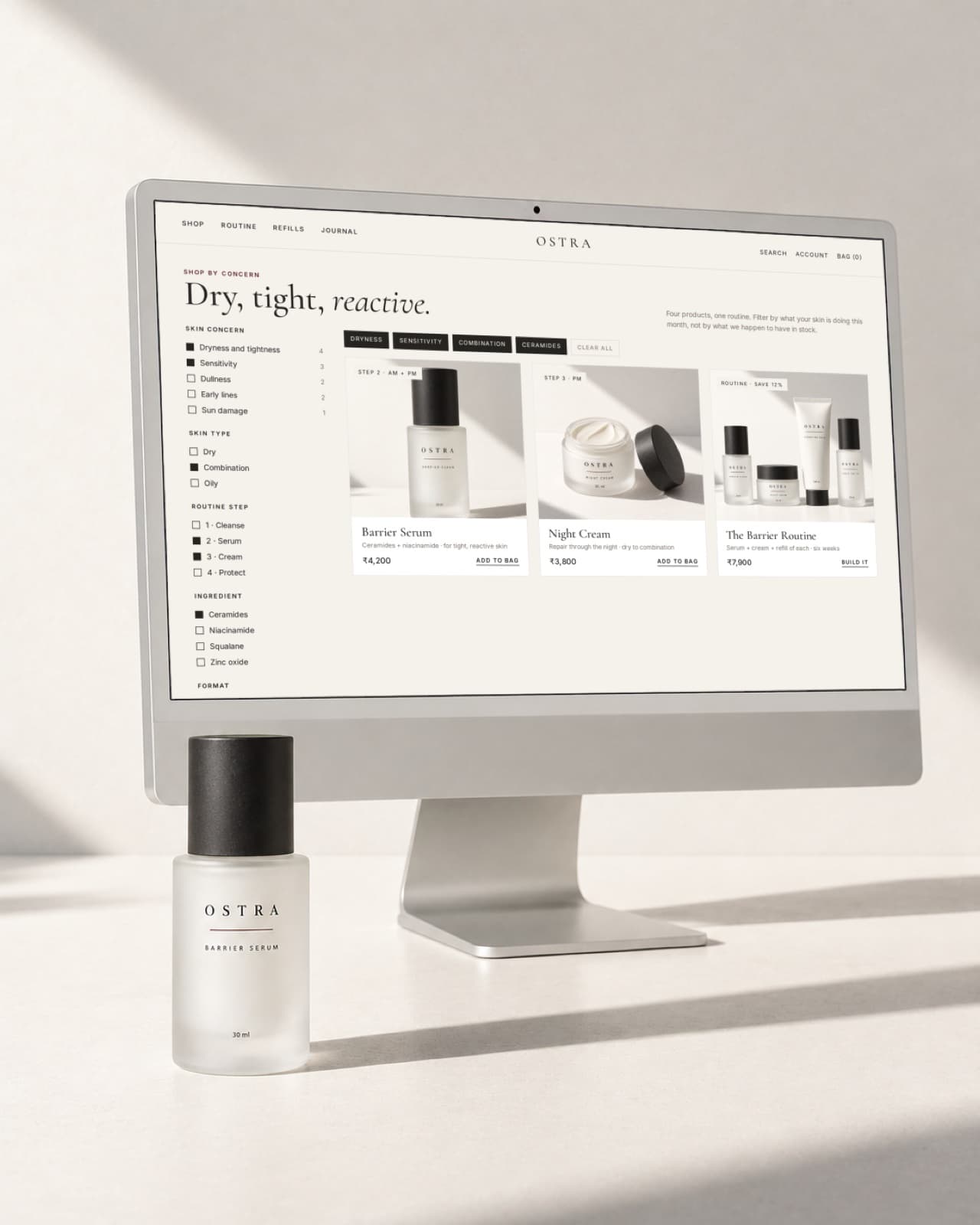 A desktop screen on a porcelain desk showing the OSTRA storefront concept sorted by skin concern